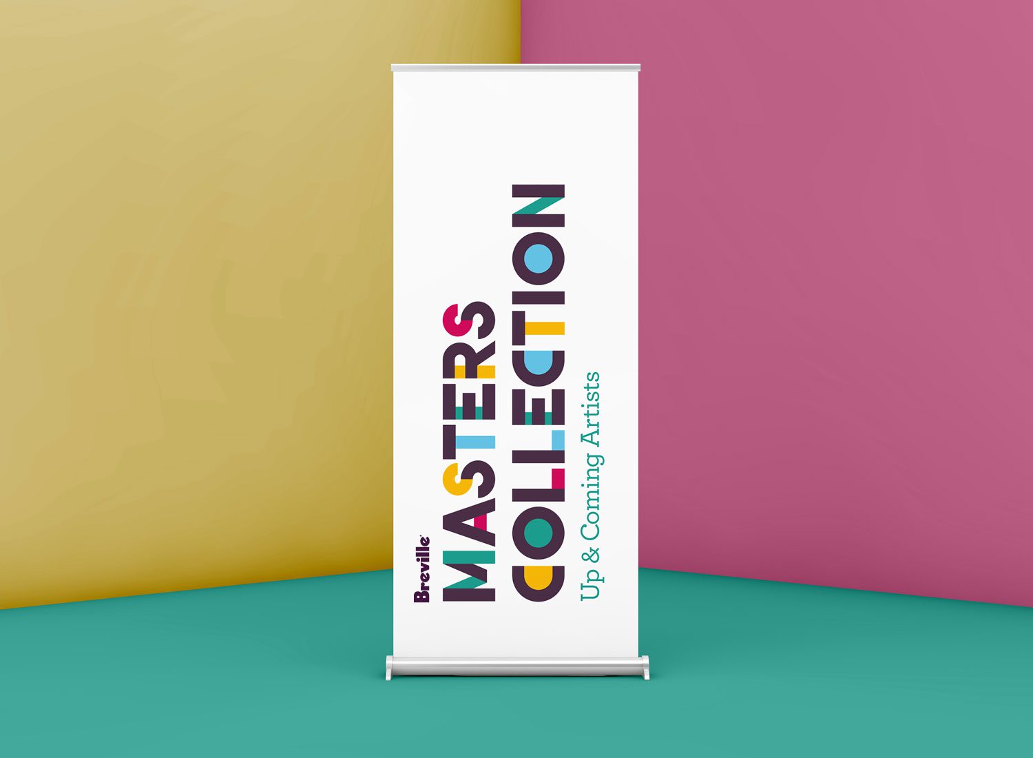 Photograph of a pull-up banner displaying the Breville Masters Collection brand identity, set against a colorful background that complements the brand's color palette.