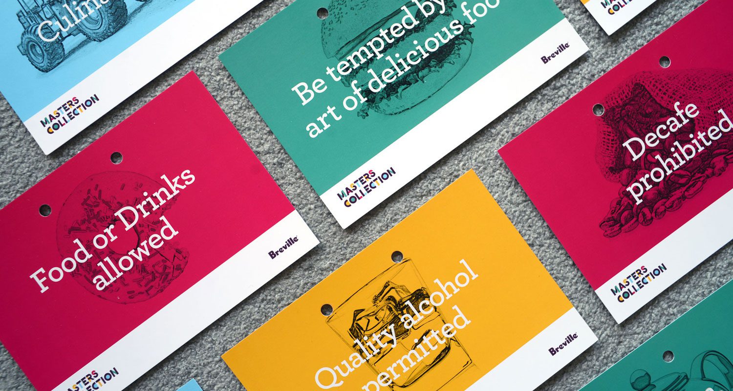 Photograph of colorful product cards featuring vibrant slogans, bright colors, and monochrome photography. The cards are laid out on a neutral background.