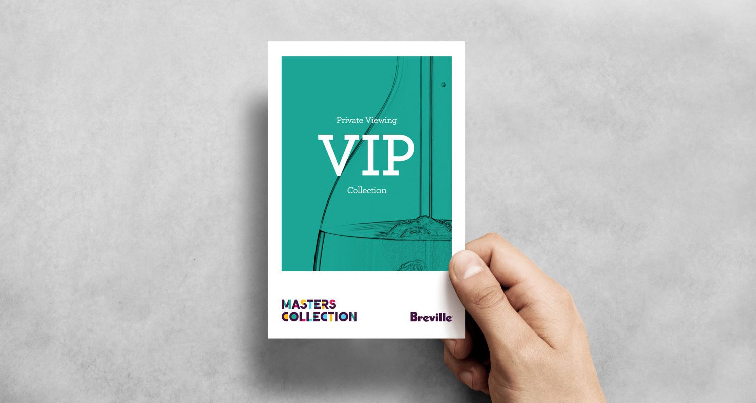 Photograph of a hand holding a VIP invitation card for a private viewing of the Breville Masters Collection event, isolated against a neutral background.