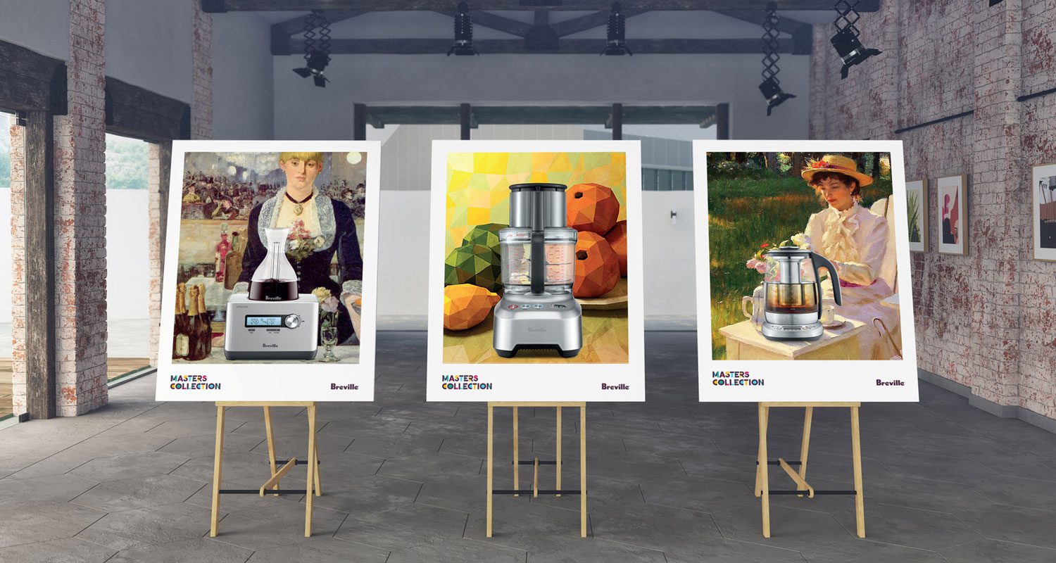 Photograph of three promotional posters displayed on easels from the Breville MasterClass campaign, each showcasing a Breville kitchen appliance stylised as a piece of art, set against a gallery-style backdrop.