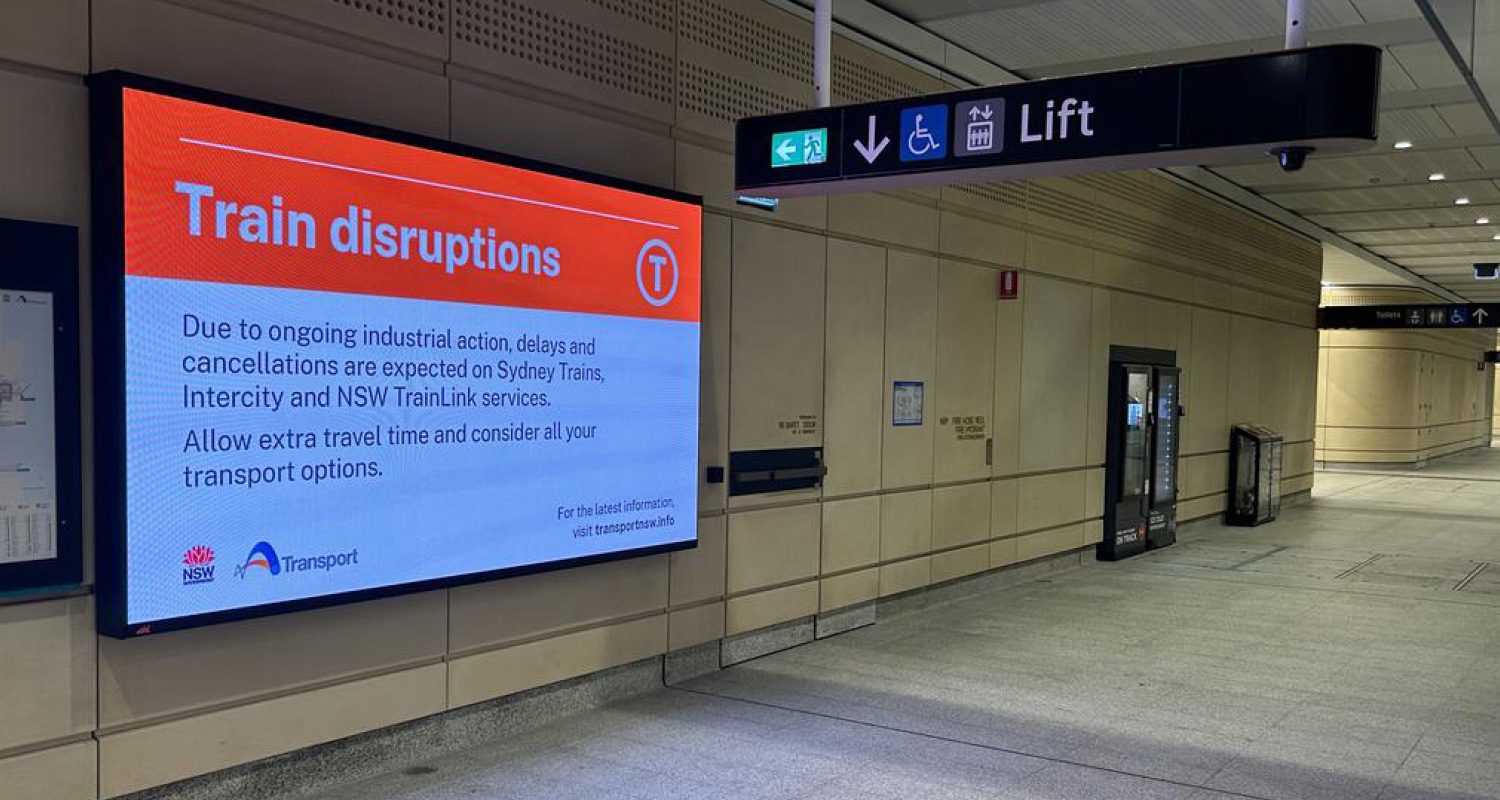 Photograph of a Transport for NSW operational template displayed on a large digital screen at a Sydney Train station.