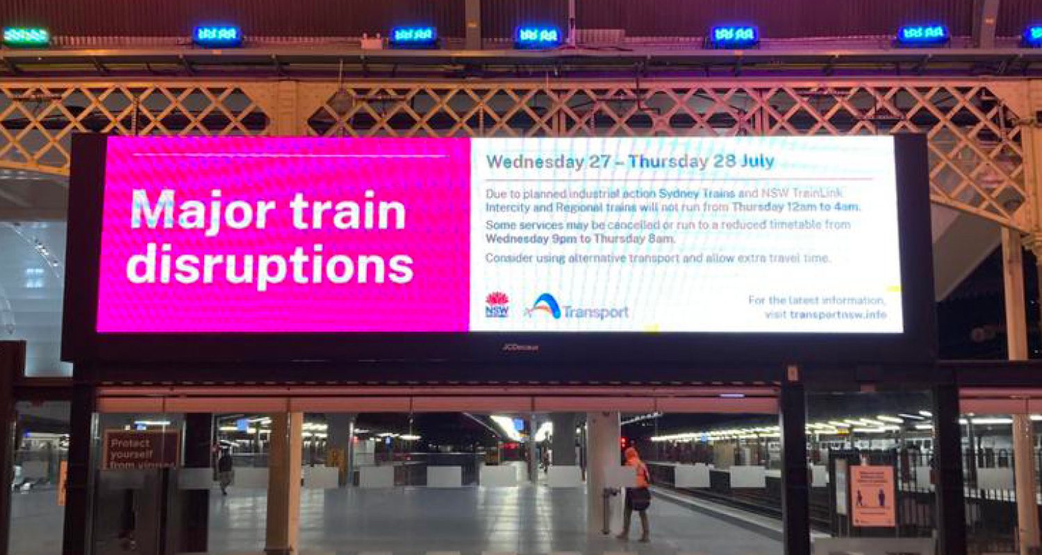 Photograph of a Transport for NSW operational template displayed on a digital banner at a Sydney Train station.