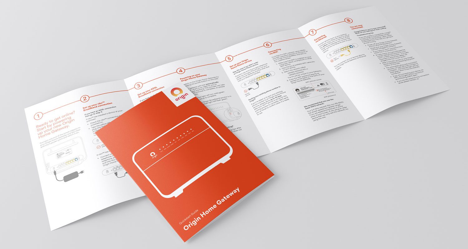 Photograph of an Origin Energy information booklet design with a modern, minimalist layout and technical illustrations, displayed against a neutral background.